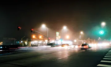 Light Pollution May Extend Mosquitoes’ Biting Season; Photo of a busy & rainy intersection
