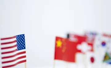 American Flag in foreground, set apart from other nations' flags in the background. 