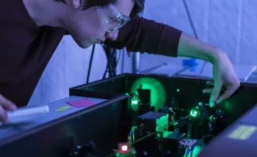 Scientist working with a laser