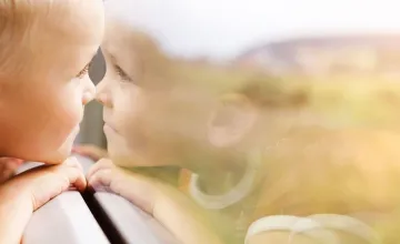 "Through the eye of the beholder: People with autism may process illusory shapes differently; stockphoto of child looking out window.