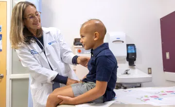 Child being cared for by Penn State University doctor.