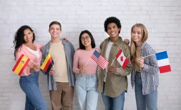 students waving international flags