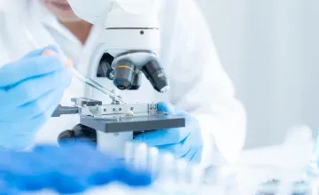 researcher with microscope