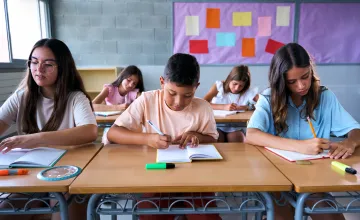 Front view of a group of students working together in a classroom