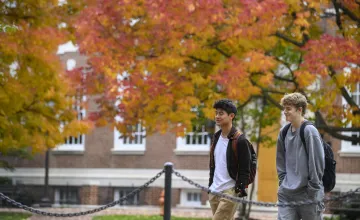 Students walking on the Johns Hopkins campus in autumn