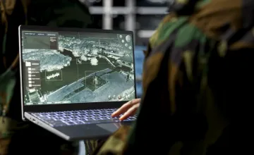 Military technician with laptop
