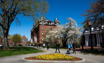 University campus during the springtime with students walking to and from class
