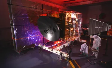 Engineers work on the Hope probe in a cleanroom