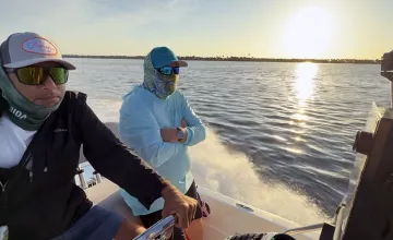 Boat captain and USF researcher on a boat in Tampa Bay