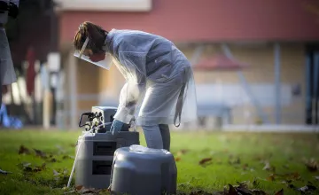 UC San Diego researcher picks up wastewater samples