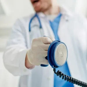 Doctor with cardiac paddles