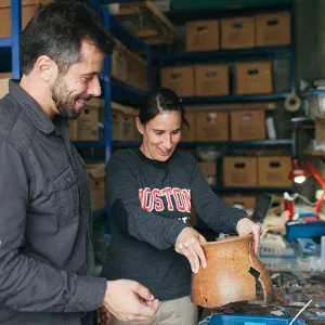 Boston University Grad Student handling pottery
