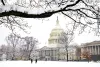 United States Capitol building with snow.
