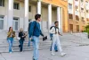 Students walking down the stairs on a campus