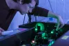 Scientist working with a laser