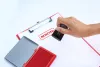 Hand holding a stamp, inking red "rejected" onto a paper.