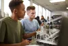 College students working on an engineering project. 