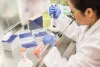 scientist working in a fume hood