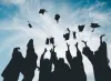 Graduates throwing their caps.