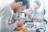 Engineering students working in a lab. 